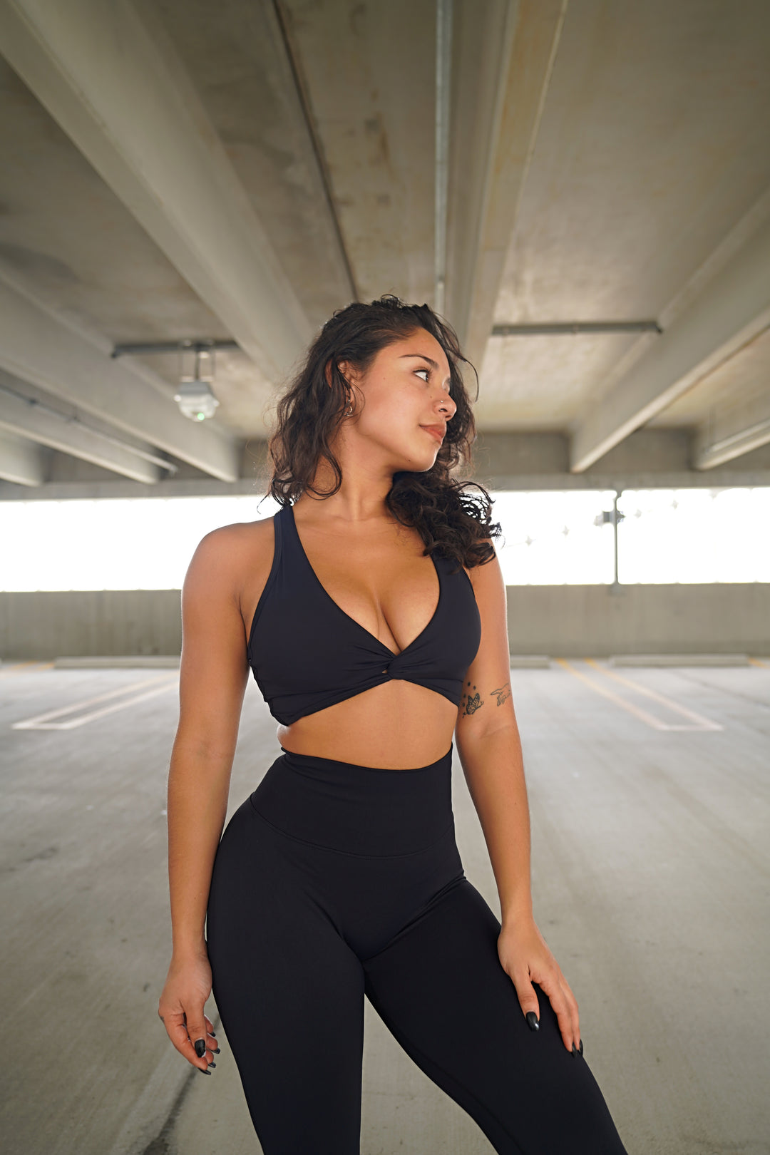 Impact Sports Bra with adjustable back strap and twist front design – available in 8 colors.